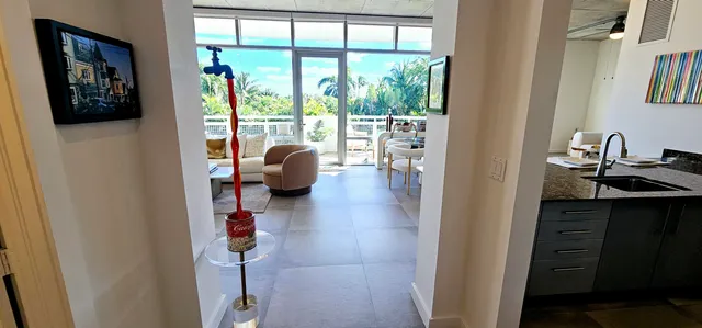 a hallway with a view of living room