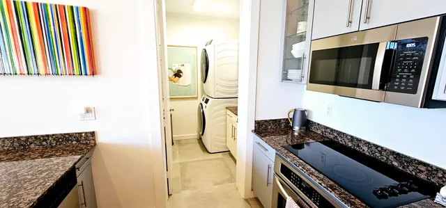 a kitchen with a stove and a refrigerator