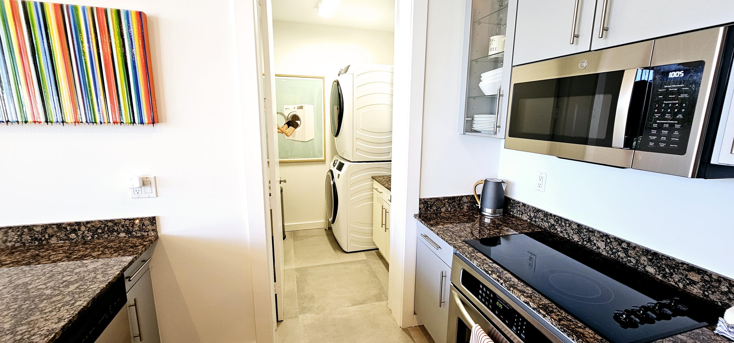 365 Southeast 6th Avenue, Unit 305 Delray Beach, FL 33483 - Photo 10 of 49 a kitchen with a stove and a refrigerator