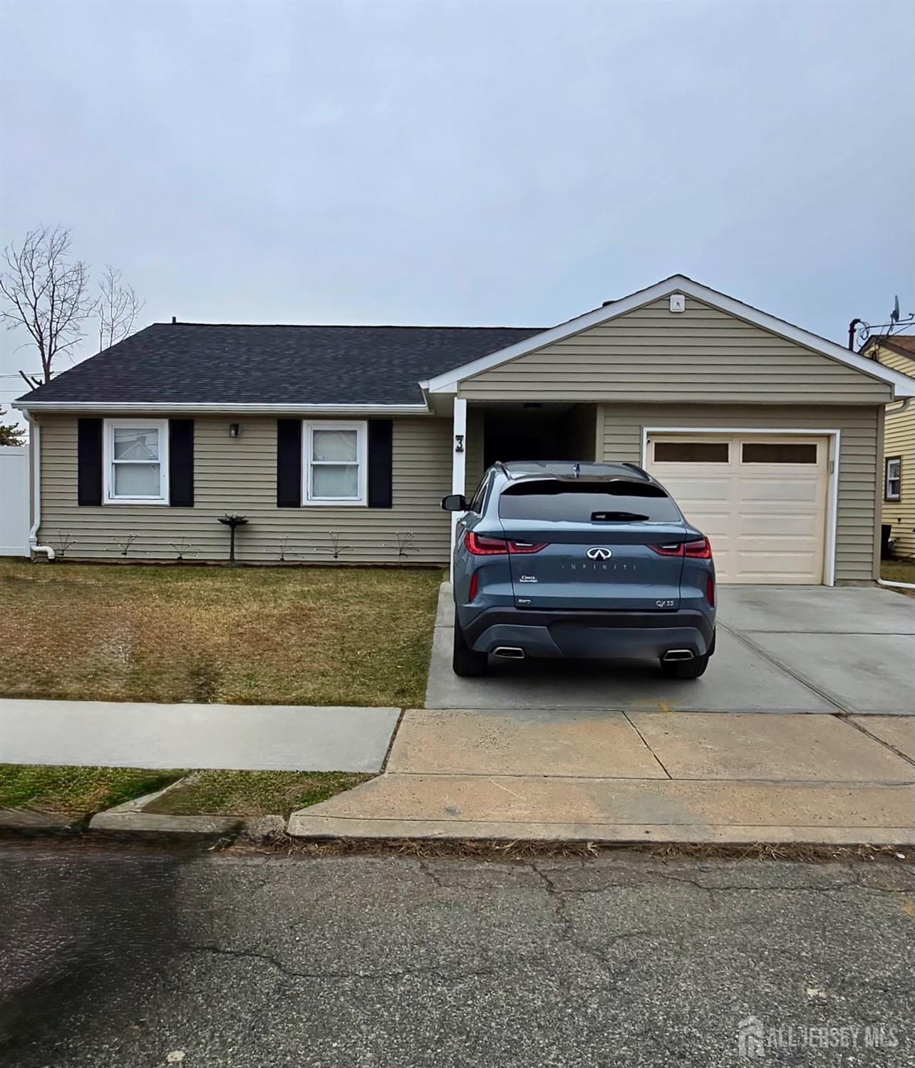 3 Jessie Street Carteret, NJ 07008 - Photo 1 of 1 a front view of a house with a yard and garage