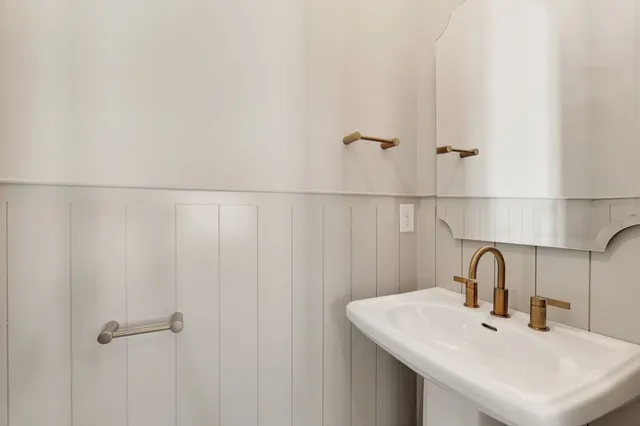 a large kitchen with granite countertop a counter space a sink stainless steel appliances and cabinets