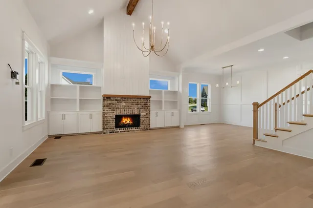 a kitchen with stainless steel appliances a stove microwave and cabinets