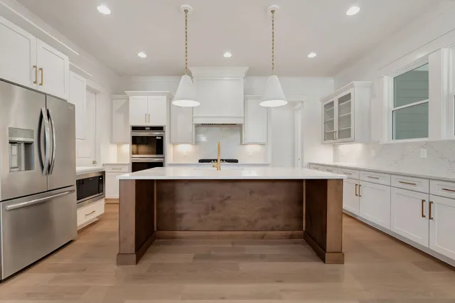 a close view of a sink and dishwasher in kitchen