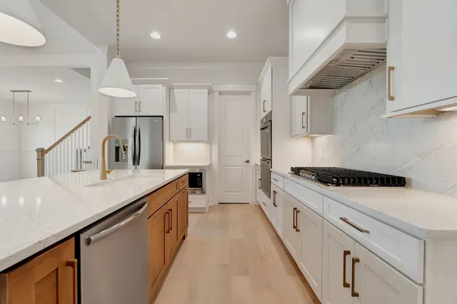 a bathroom with a double vanity sink mirror and shower