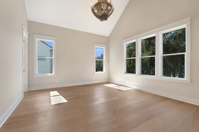 a bathroom with a sink toilet vanity and shower