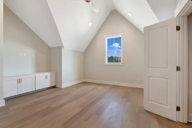 a view of a street with a building in the background