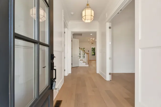 a view of a workspace with furniture and a potted plant