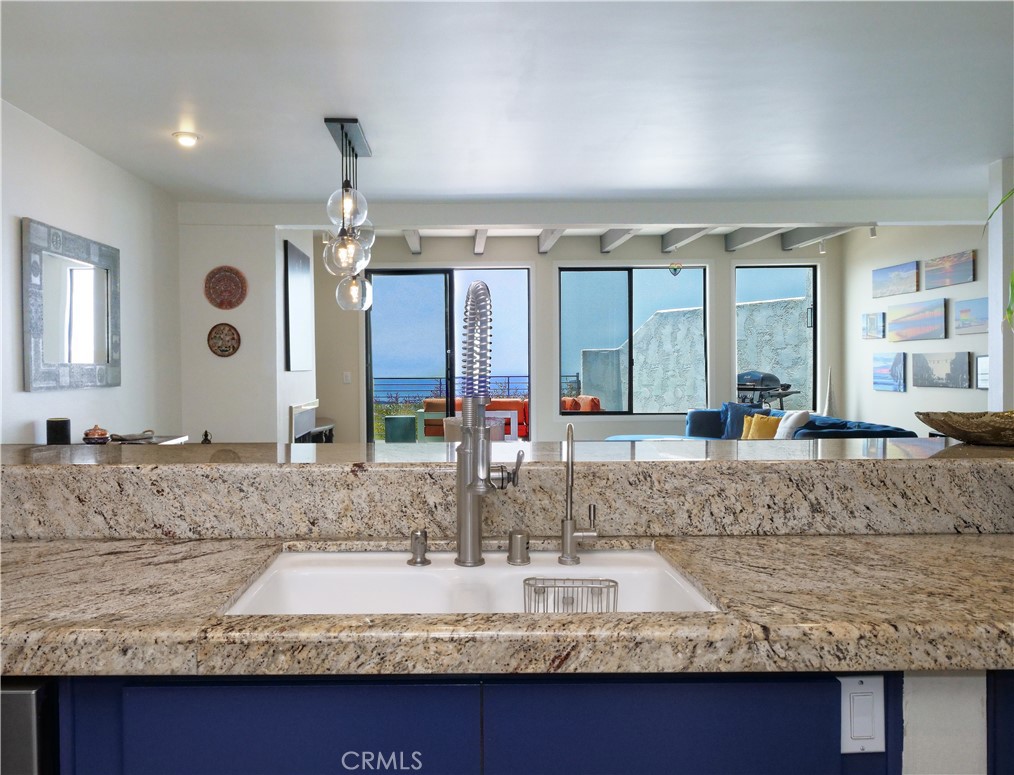 736 Gould Avenue, Unit 26 Hermosa Beach, CA 90254 - Photo 14 of 39 a bathroom with a granite countertop sink and a mirror