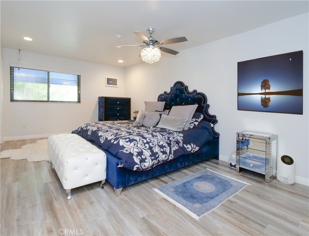 736 Gould Avenue, Unit 26 Hermosa Beach, CA 90254 - Photo 17 of 39 a bedroom with a bed and a chandelier