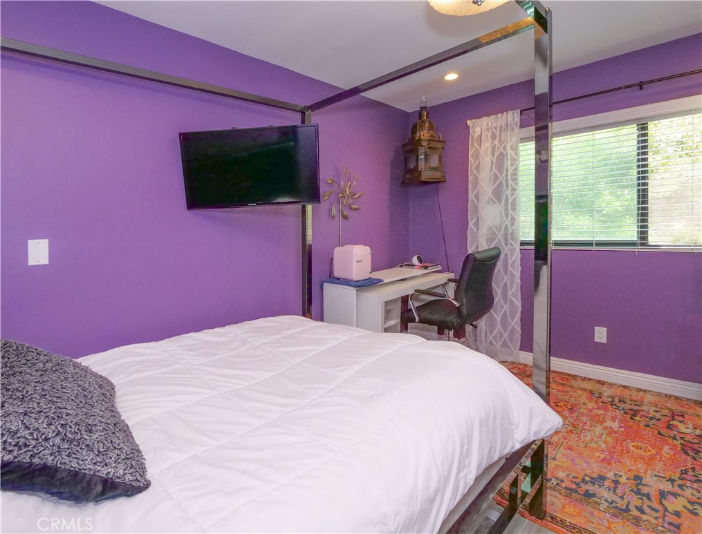 736 Gould Avenue, Unit 26 Hermosa Beach, CA 90254 - Photo 21 of 39 a bed room with a bed and a flat screen tv