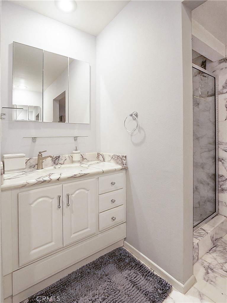 736 Gould Avenue, Unit 26 Hermosa Beach, CA 90254 - Photo 25 of 39 a bathroom with a sink and a mirror