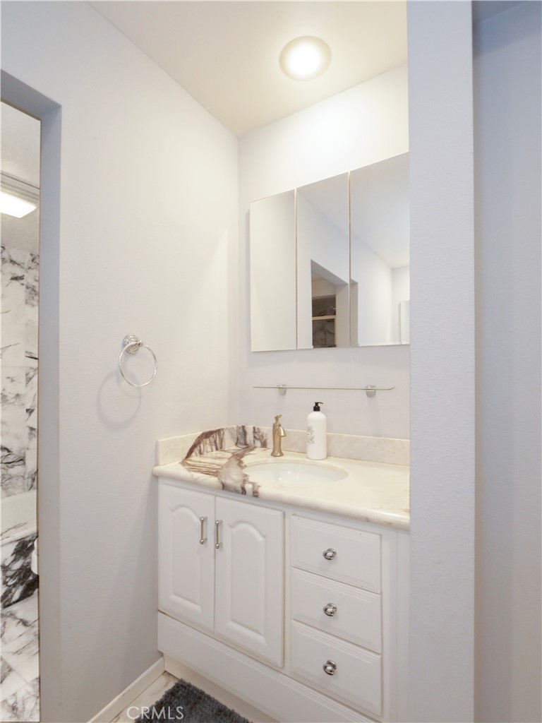 736 Gould Avenue, Unit 26 Hermosa Beach, CA 90254 - Photo 26 of 39 a bathroom with a sink vanity and mirror