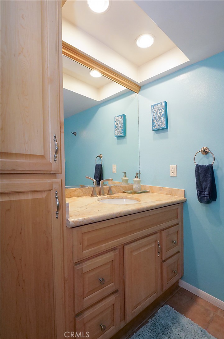 736 Gould Avenue, Unit 26 Hermosa Beach, CA 90254 - Photo 29 of 39 a bathroom with a double vanity sink and mirror
