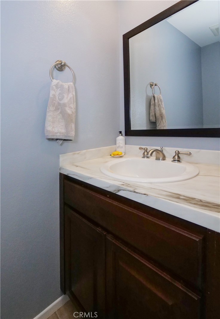 736 Gould Avenue, Unit 26 Hermosa Beach, CA 90254 - Photo 30 of 39 a bathroom with a sink vanity and a mirror
