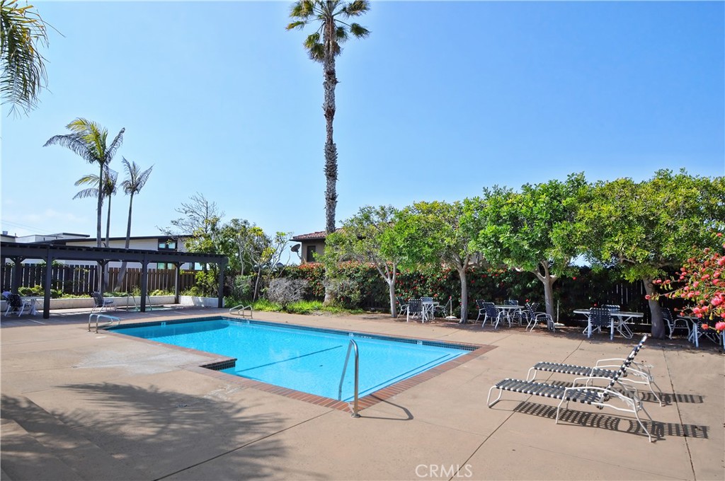 736 Gould Avenue, Unit 26 Hermosa Beach, CA 90254 - Photo 34 of 39 a view of a swimming pool with a lounge chairs
