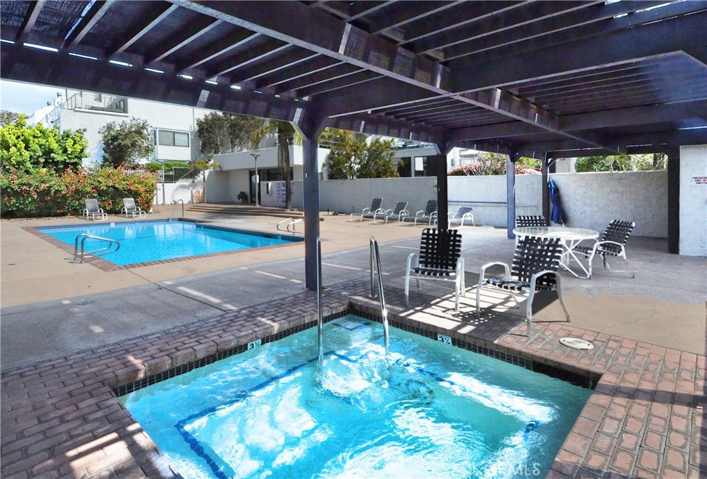 736 Gould Avenue, Unit 26 Hermosa Beach, CA 90254 - Photo 35 of 39 a view of a swimming pool with a patio