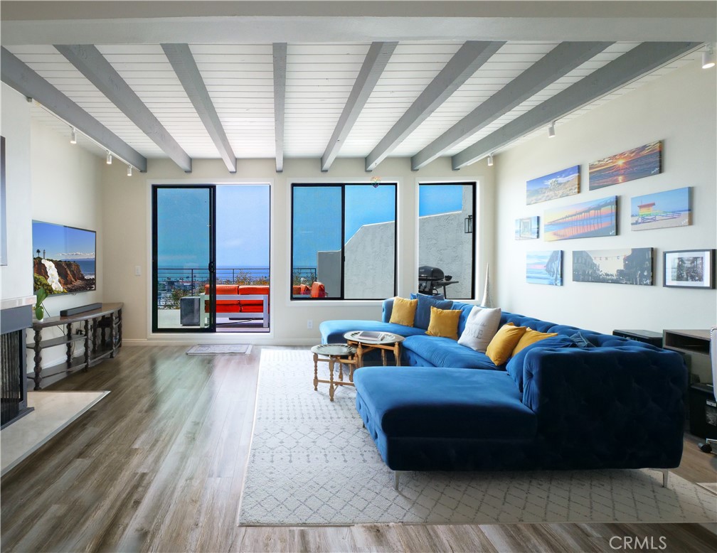 736 Gould Avenue, Unit 26 Hermosa Beach, CA 90254 - Photo 8 of 39 a living room with furniture and a flat screen tv