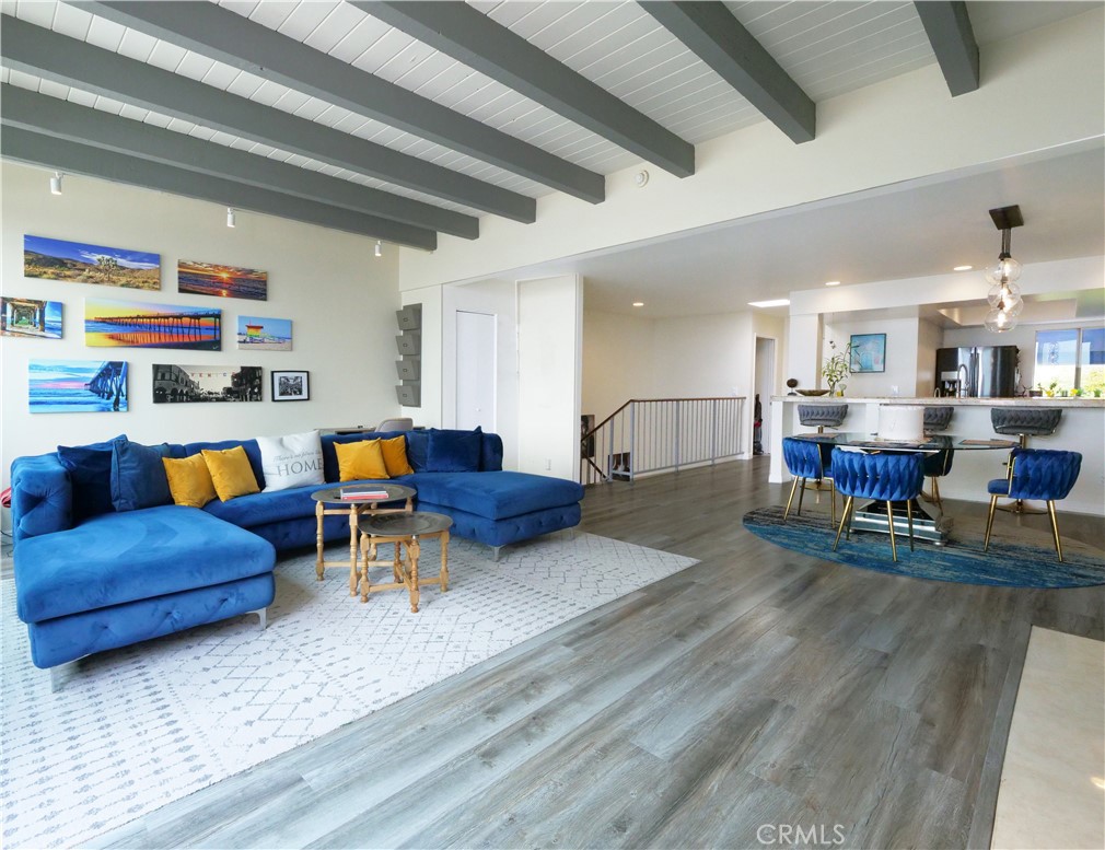 736 Gould Avenue, Unit 26 Hermosa Beach, CA 90254 - Photo 9 of 39 a living room with furniture and a dining table with kitchen view