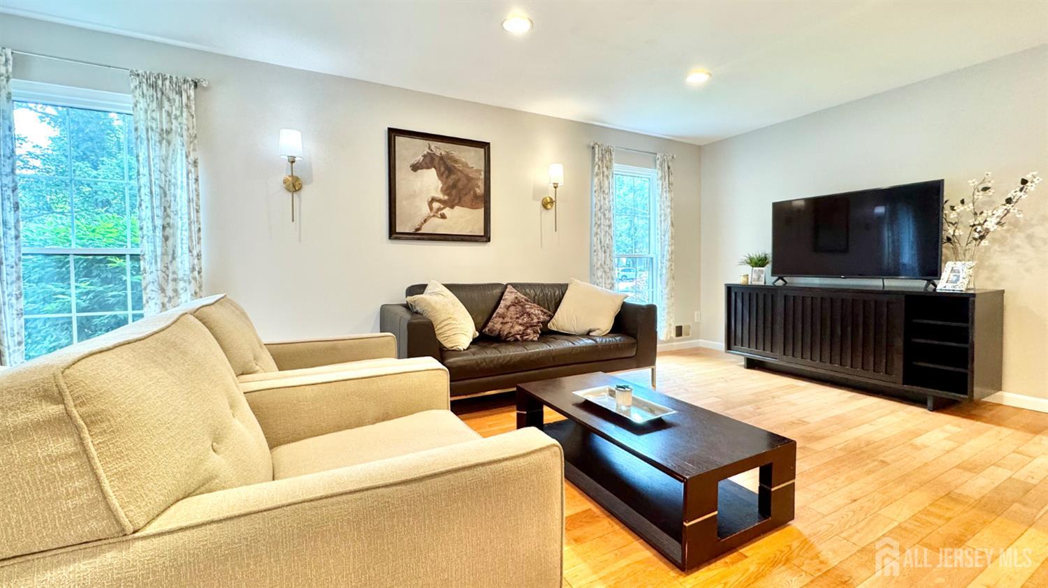 507 Timber Oaks Road Edison, NJ 08820 - Photo 2 of 17 a living room with furniture and a flat screen tv