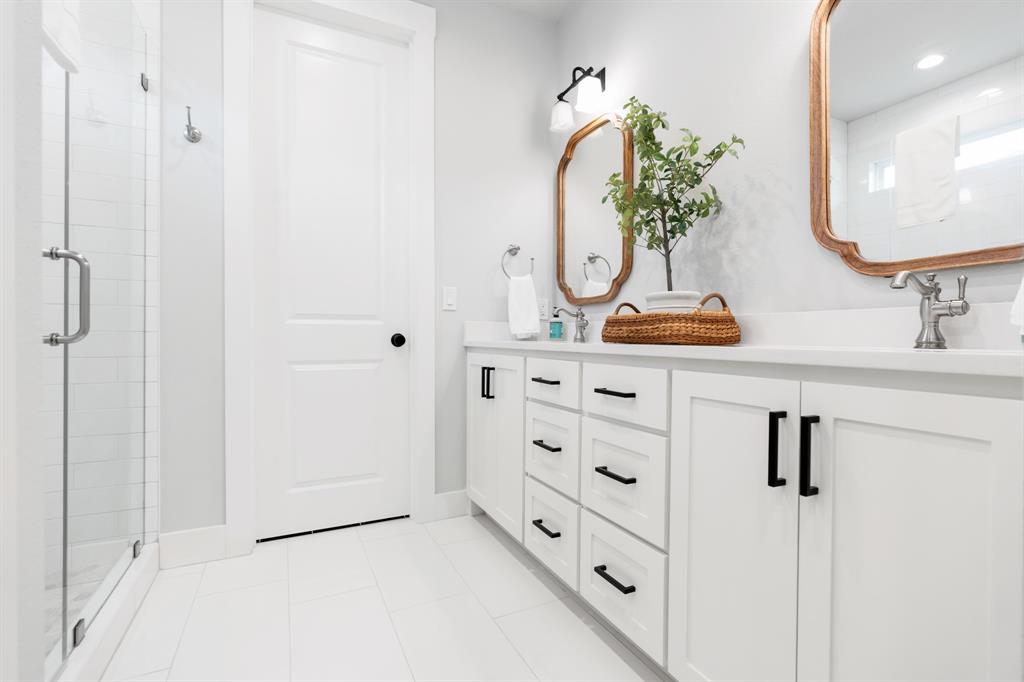 425 Proctor Avenue Waco, TX 76708 - Photo 19 of 33 a bathroom with a sink vanity and mirror