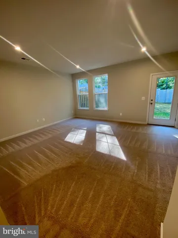 a open kitchen with stainless steel appliances granite countertop a stove and a refrigerator