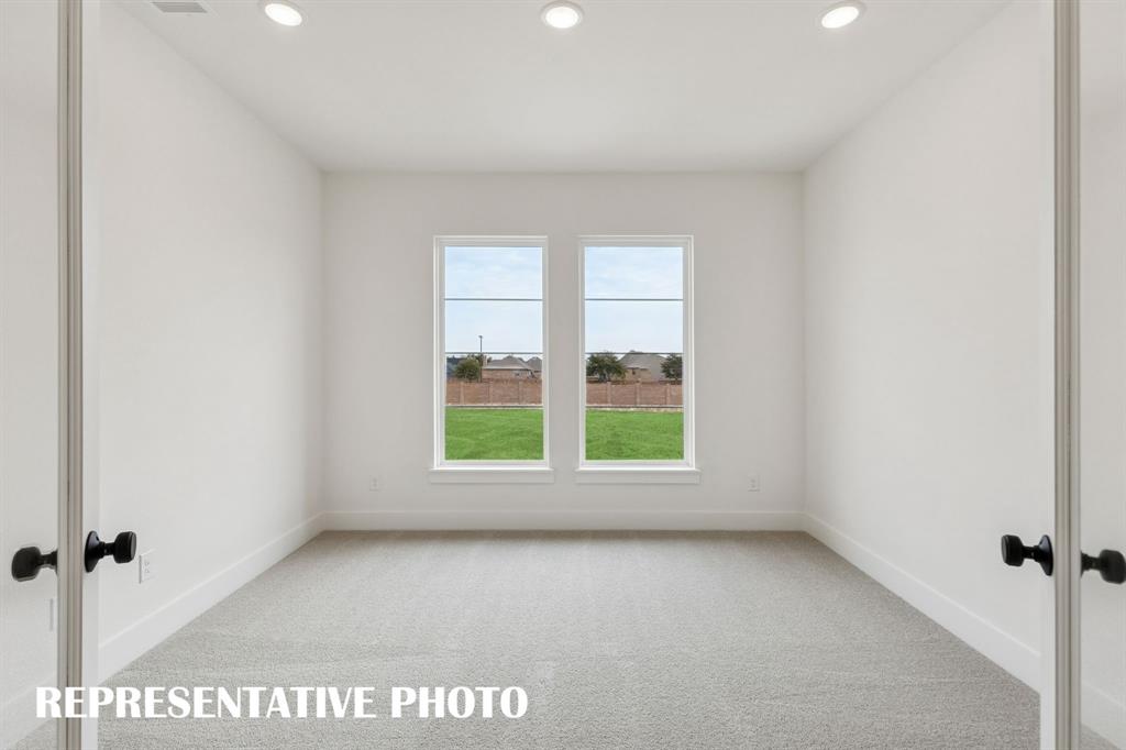 2122 Wakefield Lane Allen, TX 75013 - Photo 14 of 19 The professional working from home will appreciate this private, light filled home office. REPRESENTATIVE PHOTO