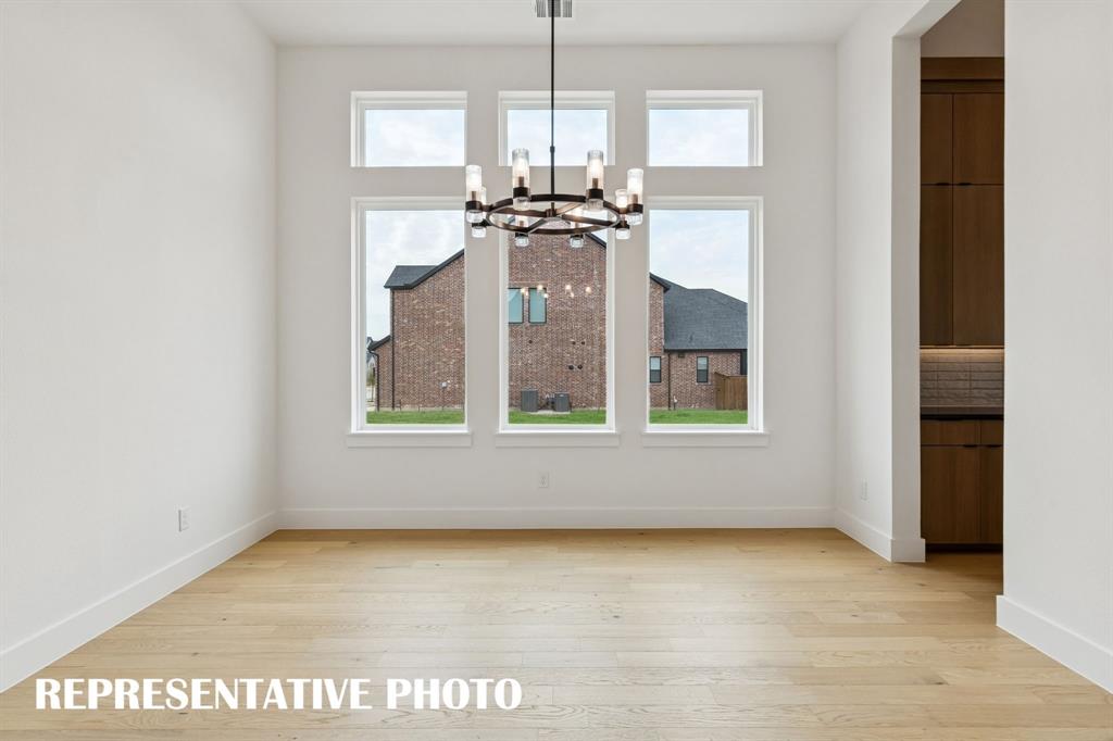 2122 Wakefield Lane Allen, TX 75013 - Photo 4 of 19 Whether it's grand dinner parties for cozy family meals, this dining room fits all occasions. REPRESENTATIVE PHOTO