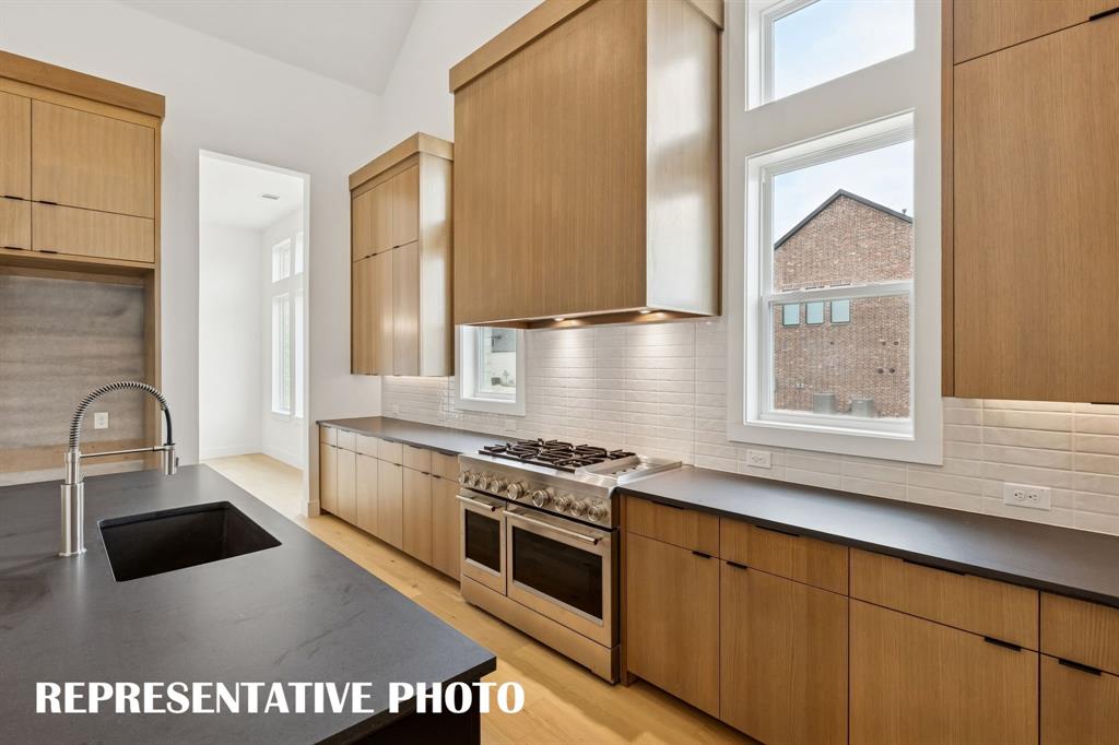 2122 Wakefield Lane Allen, TX 75013 - Photo 6 of 19 Top of the line appliances, beautiful cabinetry, impressive counter tops....this dream kitchen is one for the ages! REPRESENTATIVE PHOTO