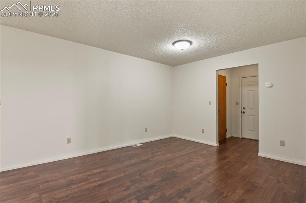 7875 Falcon Meadows Boulevard Peyton, CO 80831 - Photo 11 of 50 a view of room with wooden floor