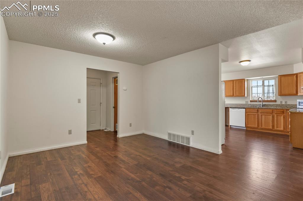 7875 Falcon Meadows Boulevard Peyton, CO 80831 - Photo 12 of 50 a view of a kitchen with a sink and a stove