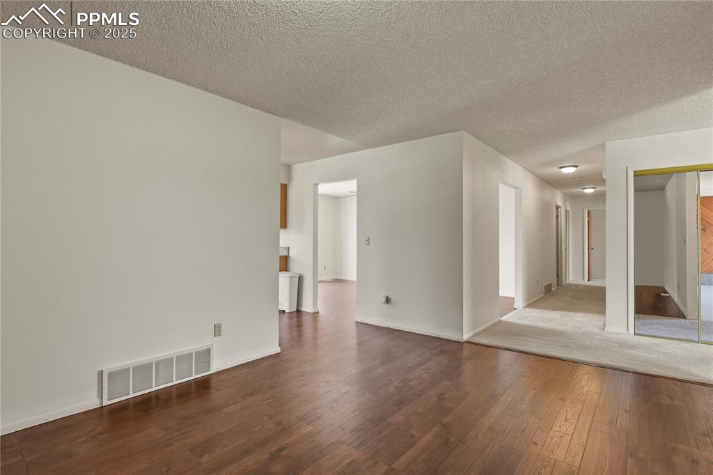 7875 Falcon Meadows Boulevard Peyton, CO 80831 - Photo 13 of 50 a view of a livingroom with wooden floor