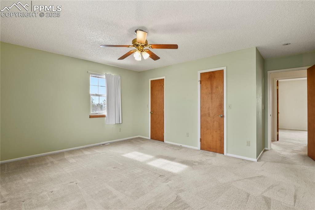 7875 Falcon Meadows Boulevard Peyton, CO 80831 - Photo 24 of 50 a view of an empty room with a window