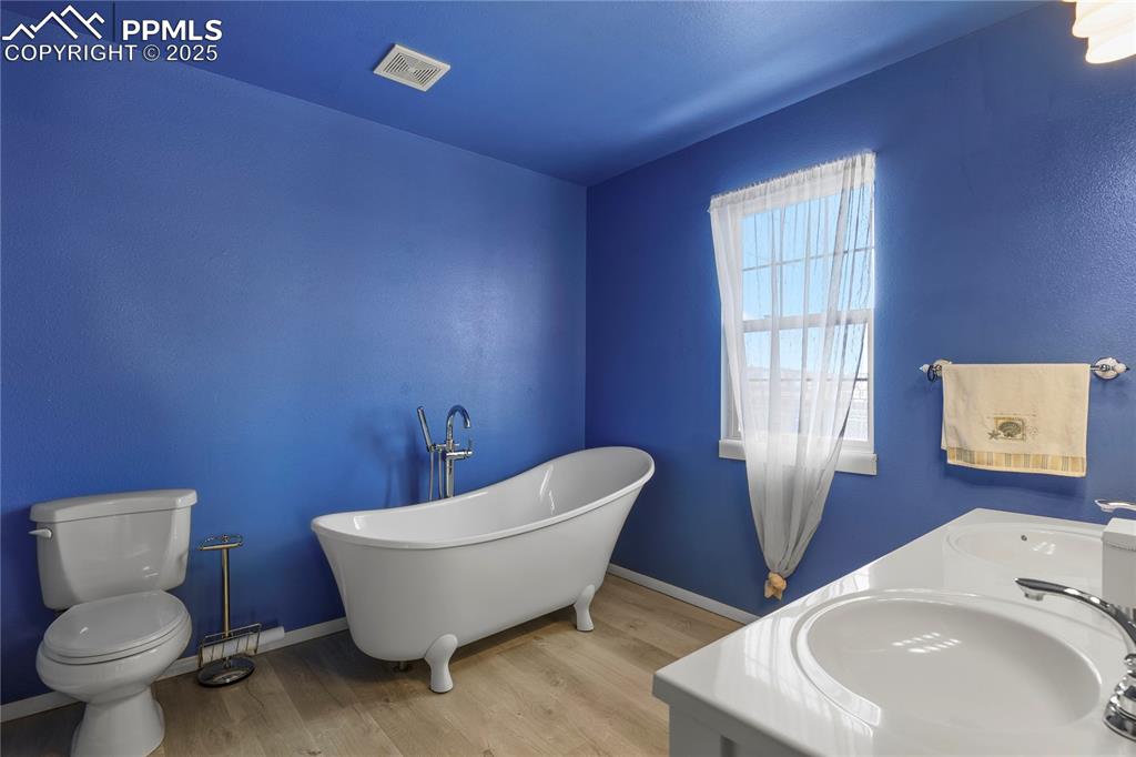 7875 Falcon Meadows Boulevard Peyton, CO 80831 - Photo 26 of 50 a bathroom with a toilet and sink