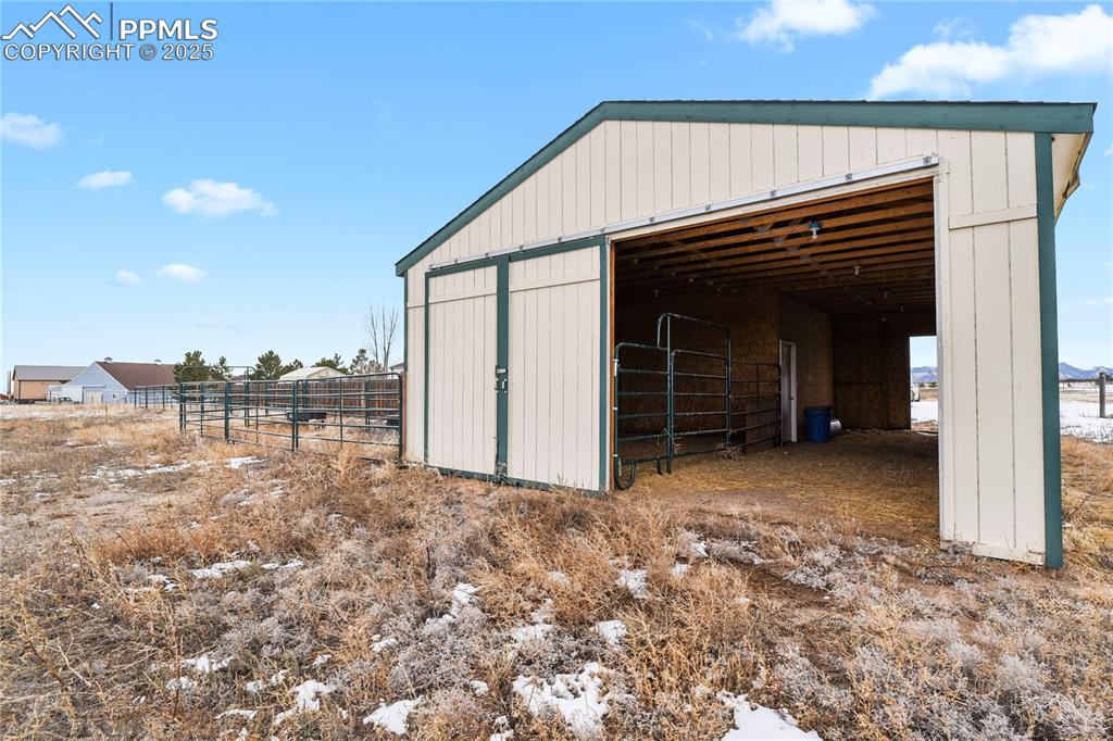 7875 Falcon Meadows Boulevard Peyton, CO 80831 - Photo 35 of 50 a view of a house with a backyard