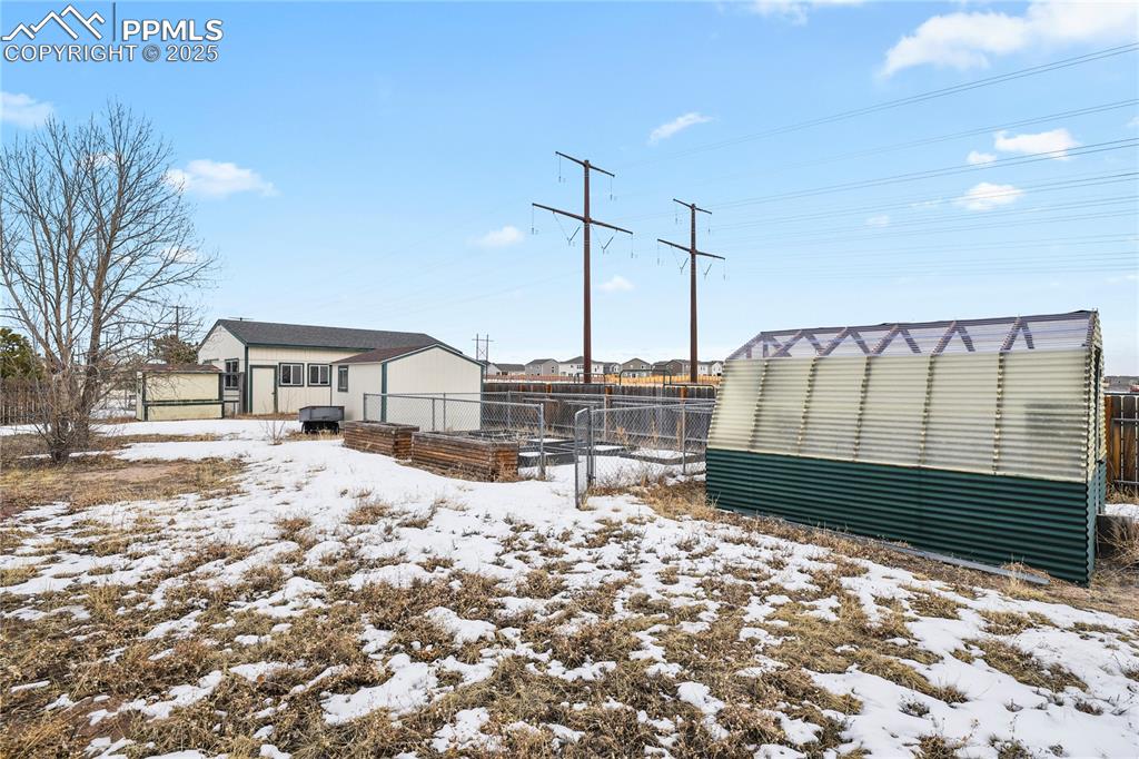 7875 Falcon Meadows Boulevard Peyton, CO 80831 - Photo 38 of 50 a roof deck with table and chairs