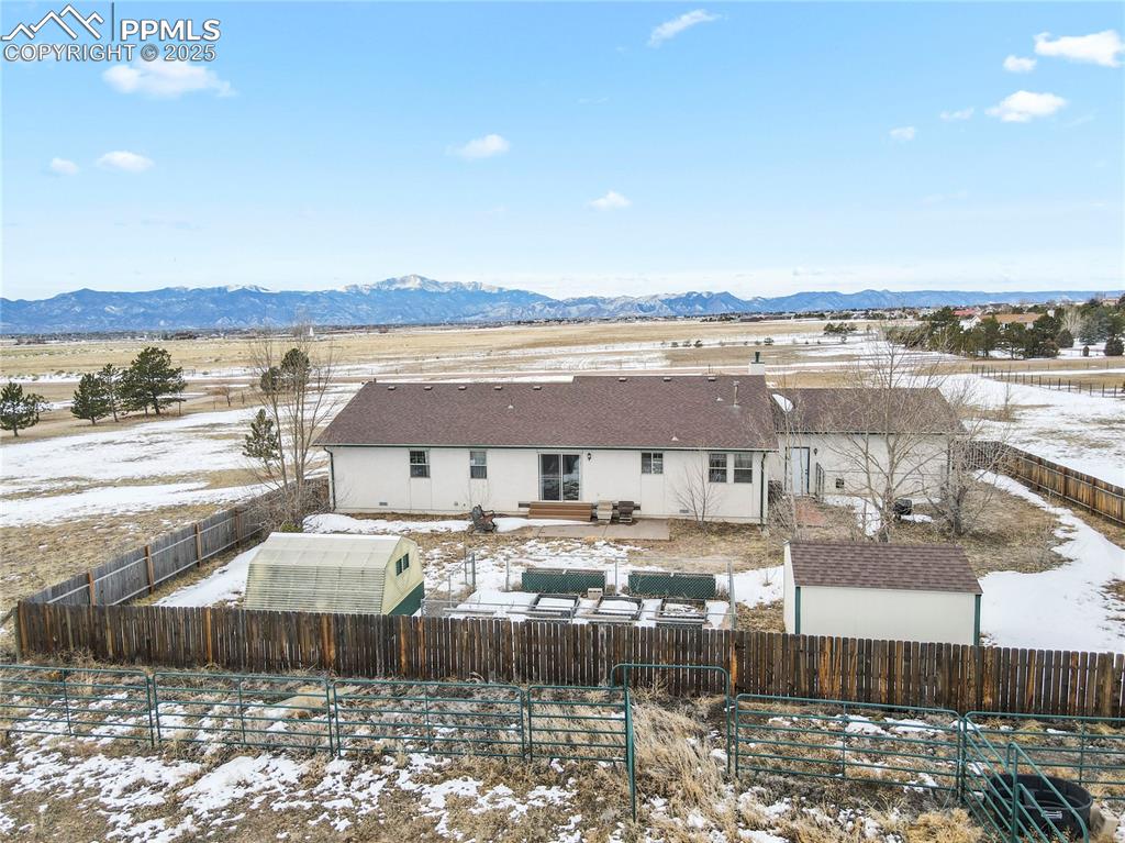 7875 Falcon Meadows Boulevard Peyton, CO 80831 - Photo 44 of 50 a view of a lake with building in front of it