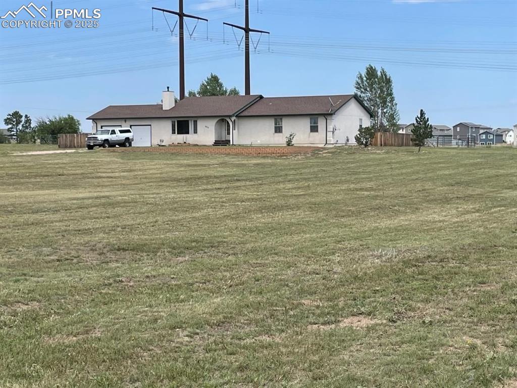 7875 Falcon Meadows Boulevard Peyton, CO 80831 - Photo 46 of 50 a view of a bathroom with a sink and mirror