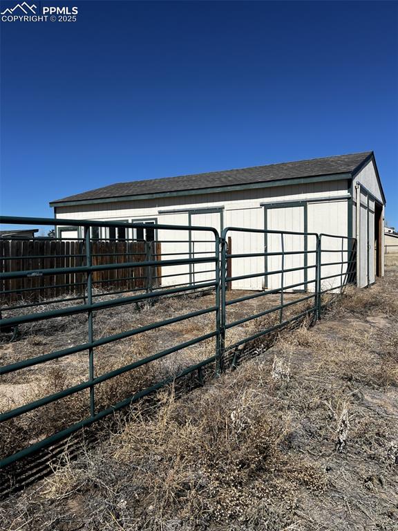 7875 Falcon Meadows Boulevard Peyton, CO 80831 - Photo 48 of 50 a view of a room with wooden stairs