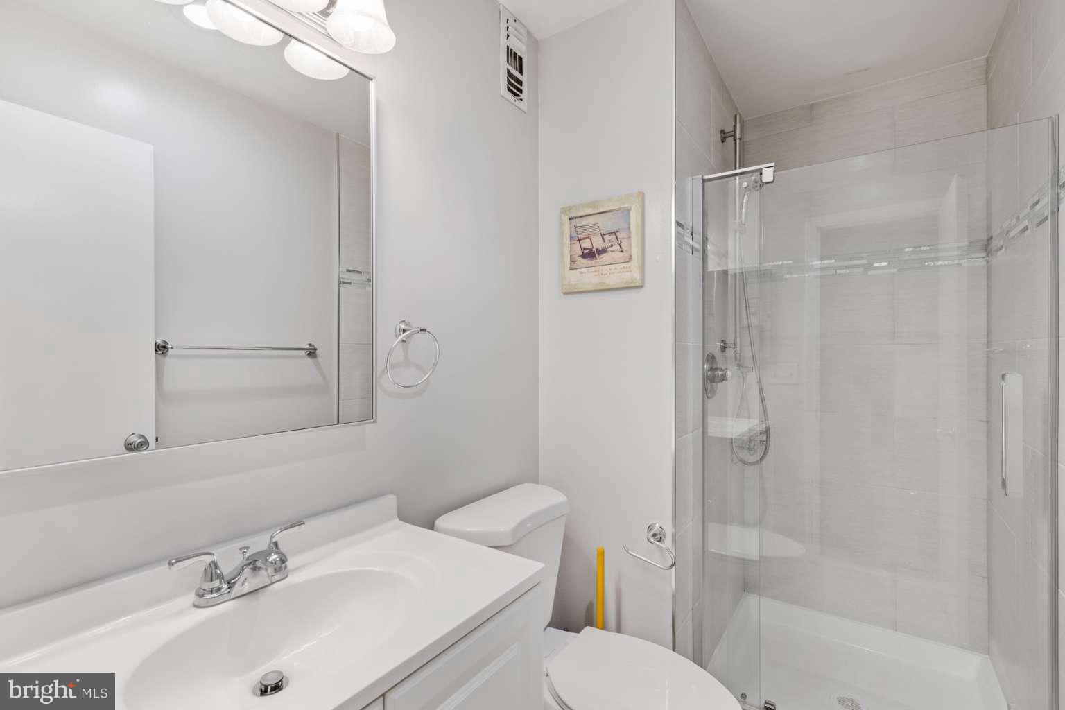 39633 Round Robin Way, Unit 2602 Bethany Beach, DE 19930 - Photo 17 of 43 a bathroom with a sink toilet and shower