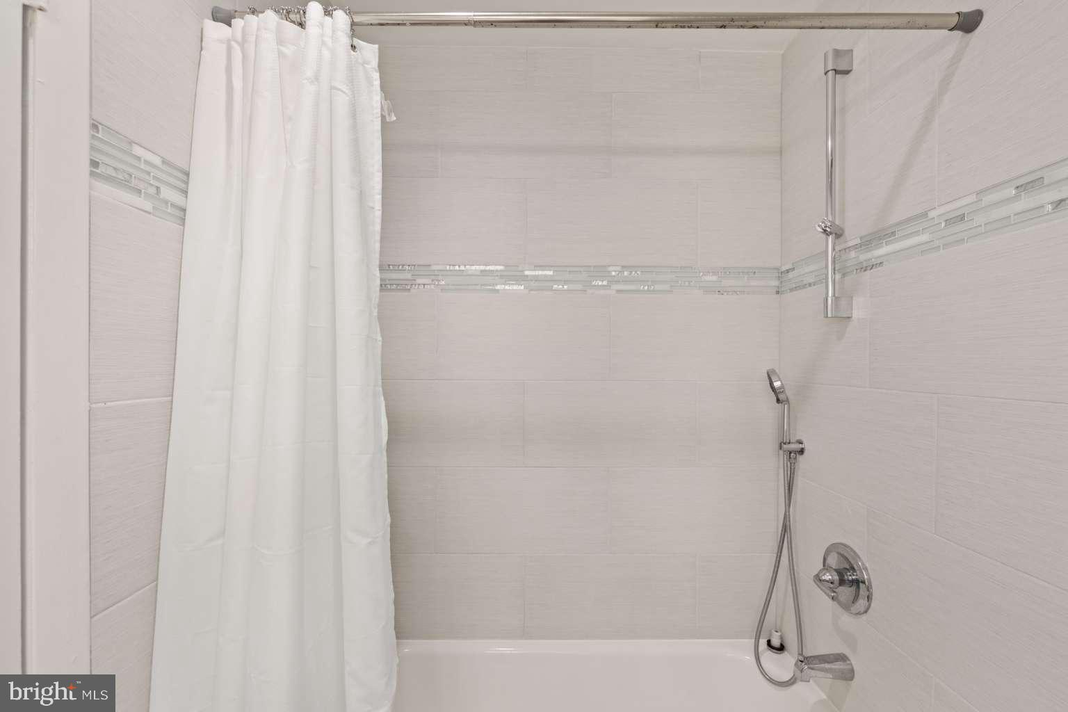 39633 Round Robin Way, Unit 2602 Bethany Beach, DE 19930 - Photo 21 of 43 a bathroom with a shower