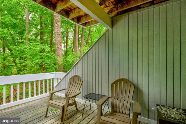 a view of a forest from a balcony