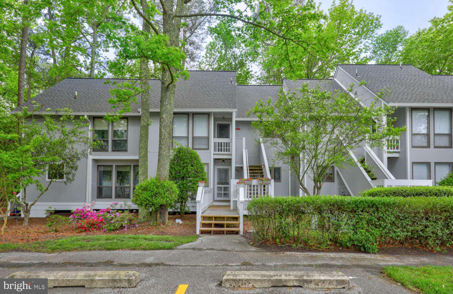 39633 Round Robin Way, Unit 2602 Bethany Beach, DE 19930 - Photo 26 of 43 front view of house with a yard