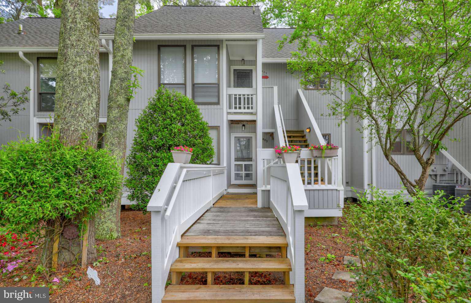 39633 Round Robin Way, Unit 2602 Bethany Beach, DE 19930 - Photo 28 of 43 front view of house with a yard