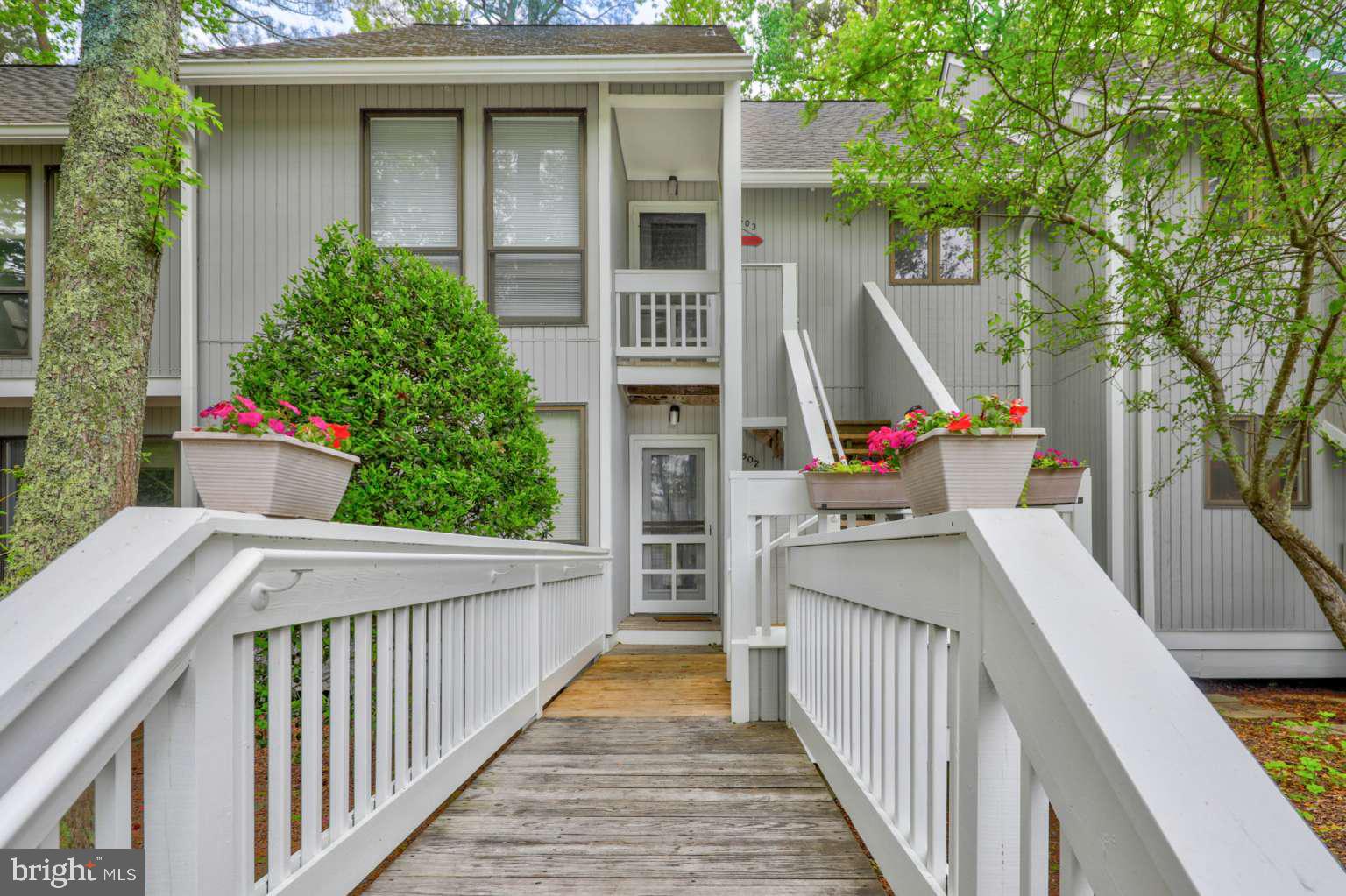 39633 Round Robin Way, Unit 2602 Bethany Beach, DE 19930 - Photo 30 of 43 a view of front door and potted plants
