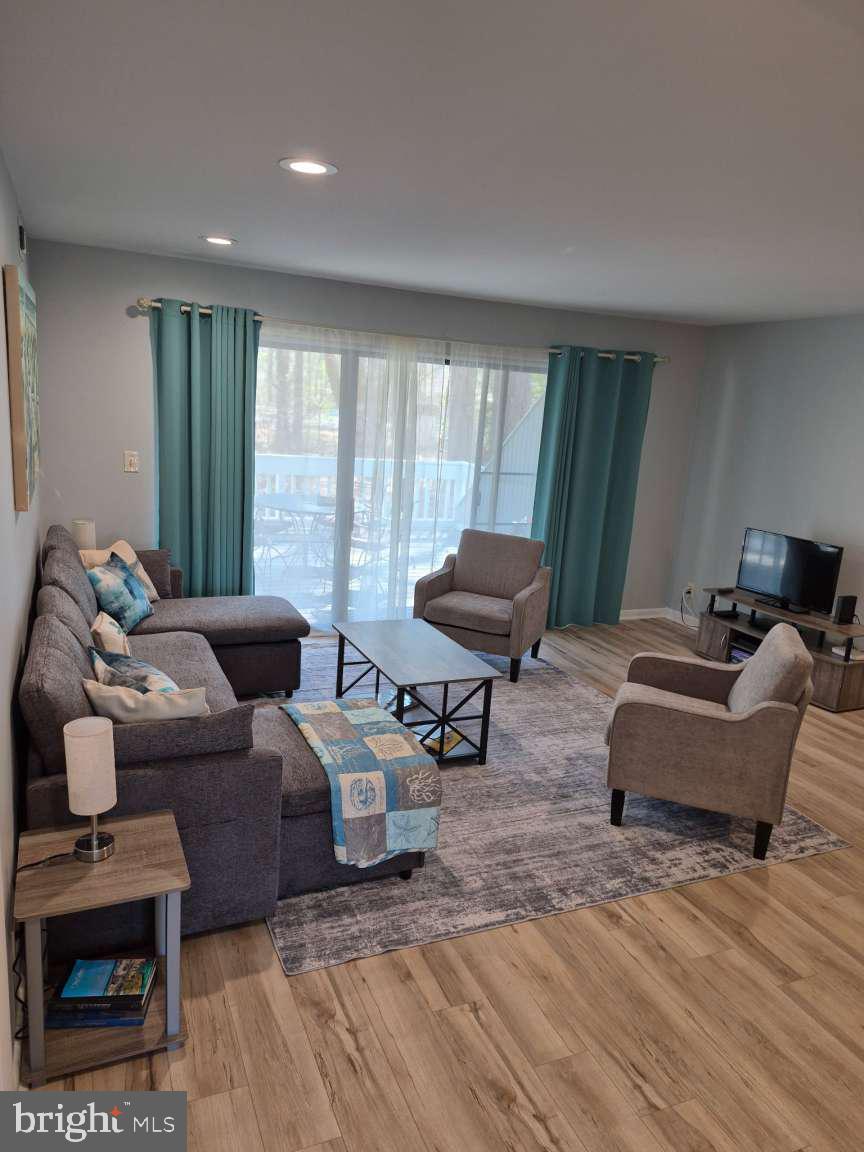 39633 Round Robin Way, Unit 2602 Bethany Beach, DE 19930 - Photo 3 of 43 a living room with furniture and a large window