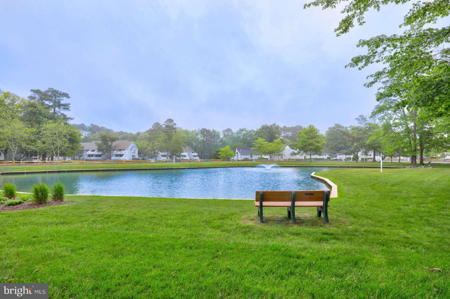 39633 Round Robin Way, Unit 2602 Bethany Beach, DE 19930 - Photo 31 of 43 a view of lake with table and chairs