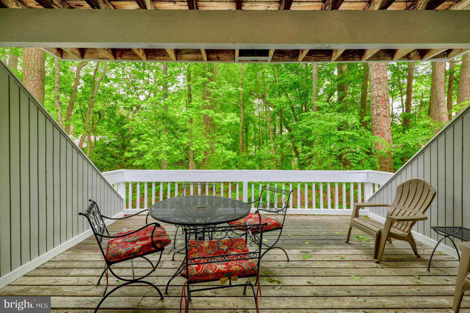 39633 Round Robin Way, Unit 2602 Bethany Beach, DE 19930 - Photo 33 of 43 a view of a chairs in wooden deck
