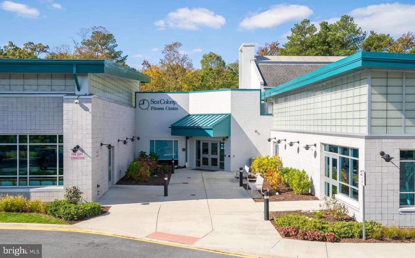 39633 Round Robin Way, Unit 2602 Bethany Beach, DE 19930 - Photo 39 of 43 a front view of a house with garden