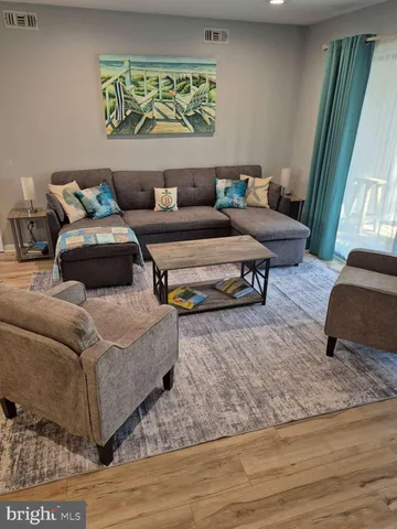 a living room with furniture and a rug