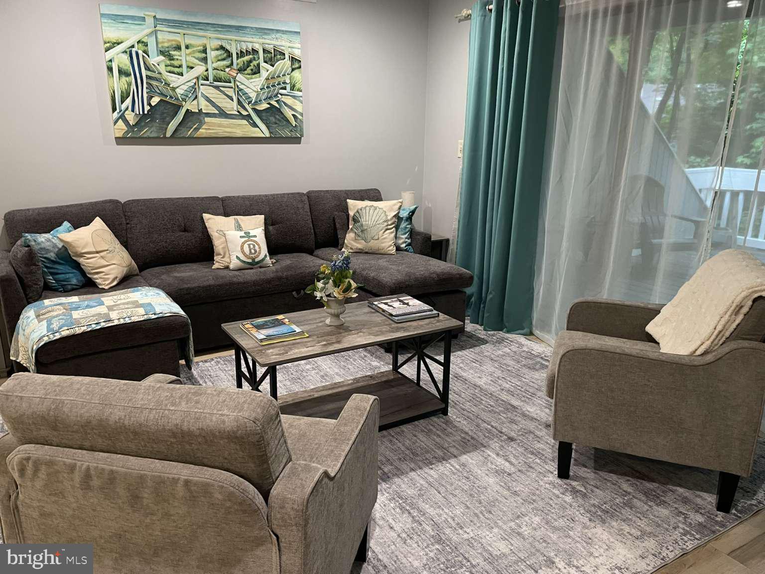 39633 Round Robin Way, Unit 2602 Bethany Beach, DE 19930 - Photo 5 of 43 a living room with furniture and a window